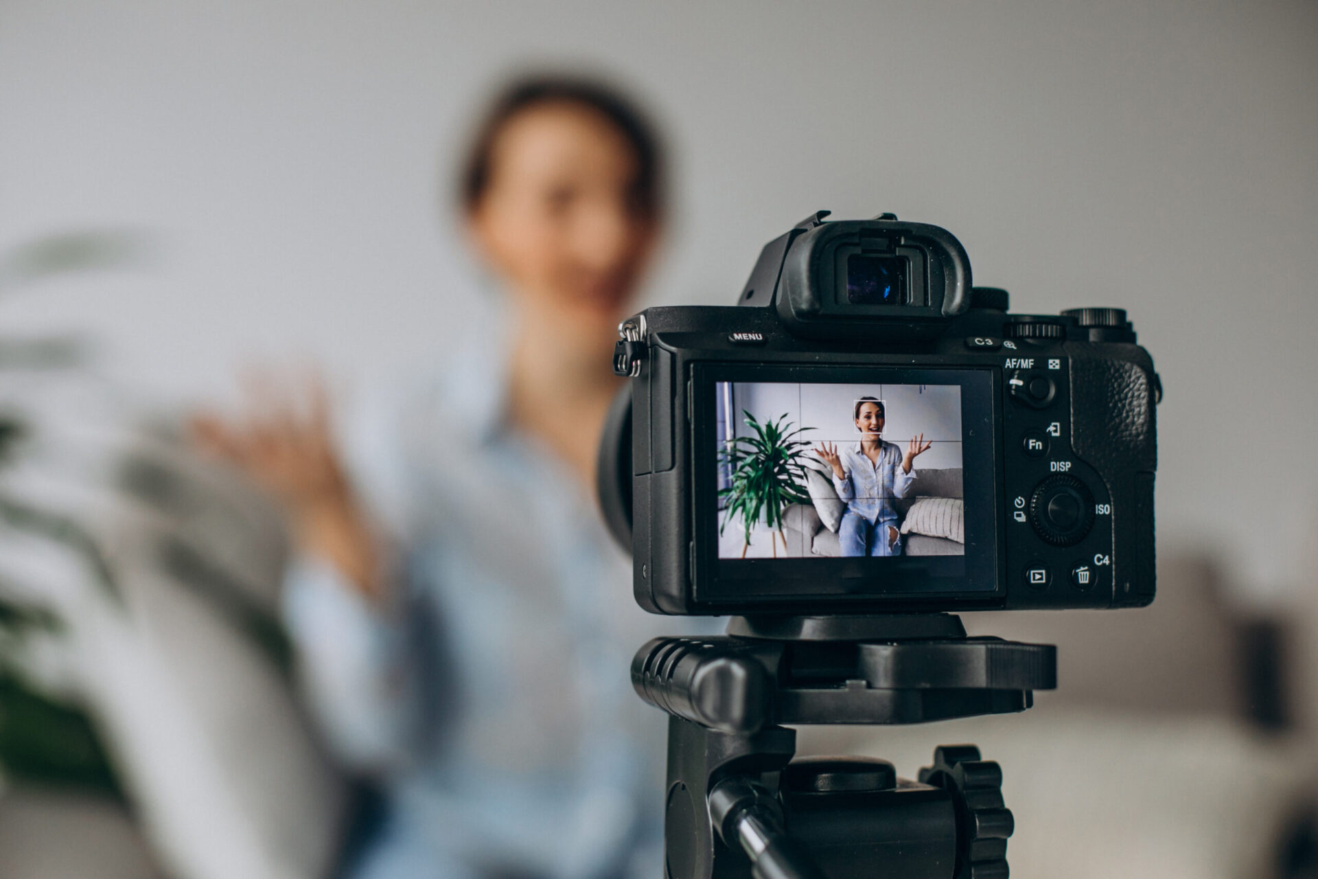 young woman blogger recording video camera scaled