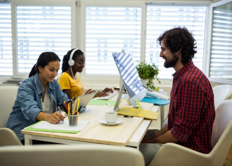 group graphic designers working together 1170 1087