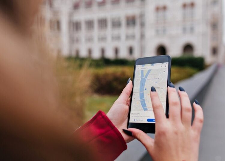 woman with trendy manicure using gps search right way 197531 6447